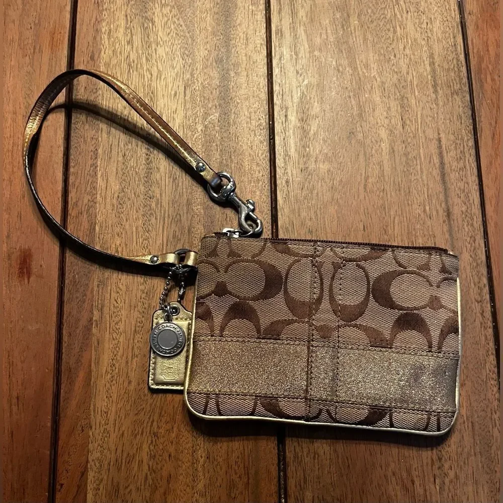 Coach Brown and Tan Signature Wristlet with gold stripe. Vintage 4x6 inches